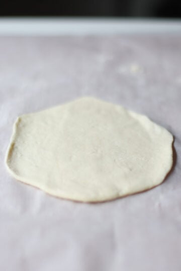 A piece of the dough rolled out flat.