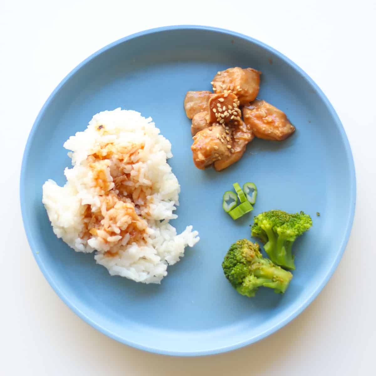 A deconstructed meal for a toddler on a blue plate.