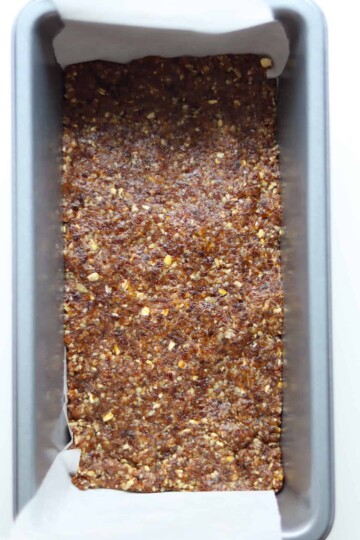 The processed Larabar ingredients shaped in a loaf pan.
