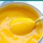 Scooped mango puree in a bowl.