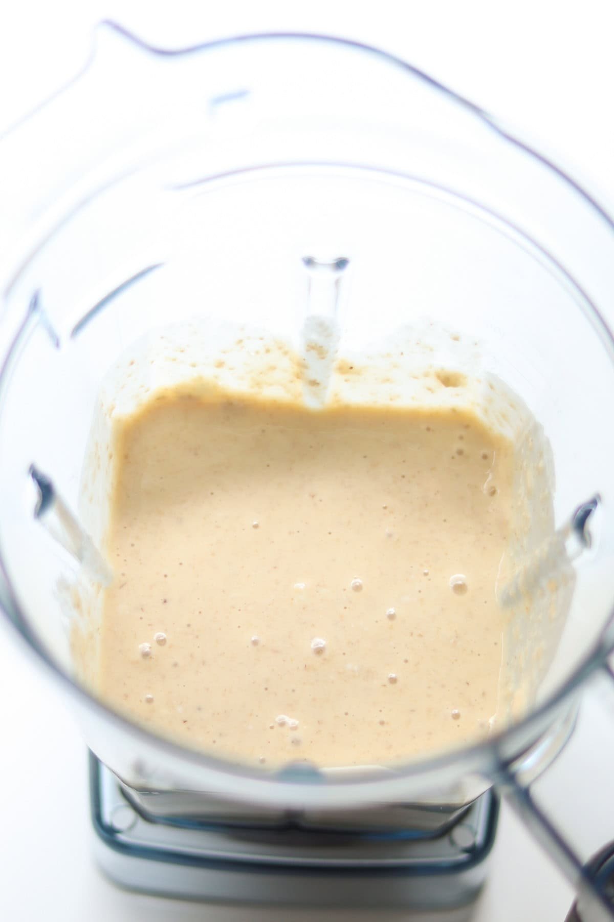 Ingredients for cottage cheese pancakes in a blender container after they've been blended.