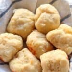 8 cheese rolls in towel lined bowl.