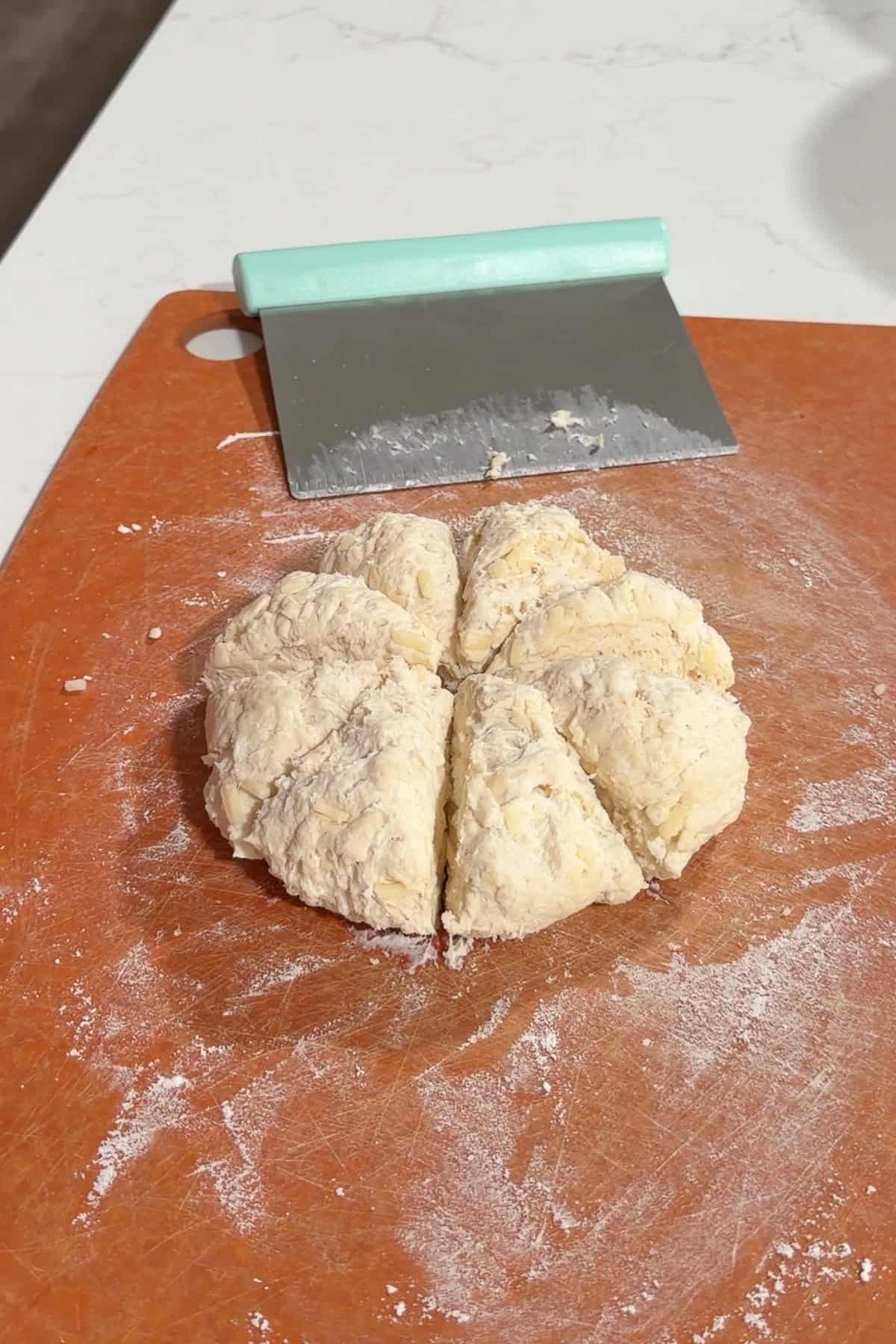 Cut the cheese roll dough into 8 pieces.