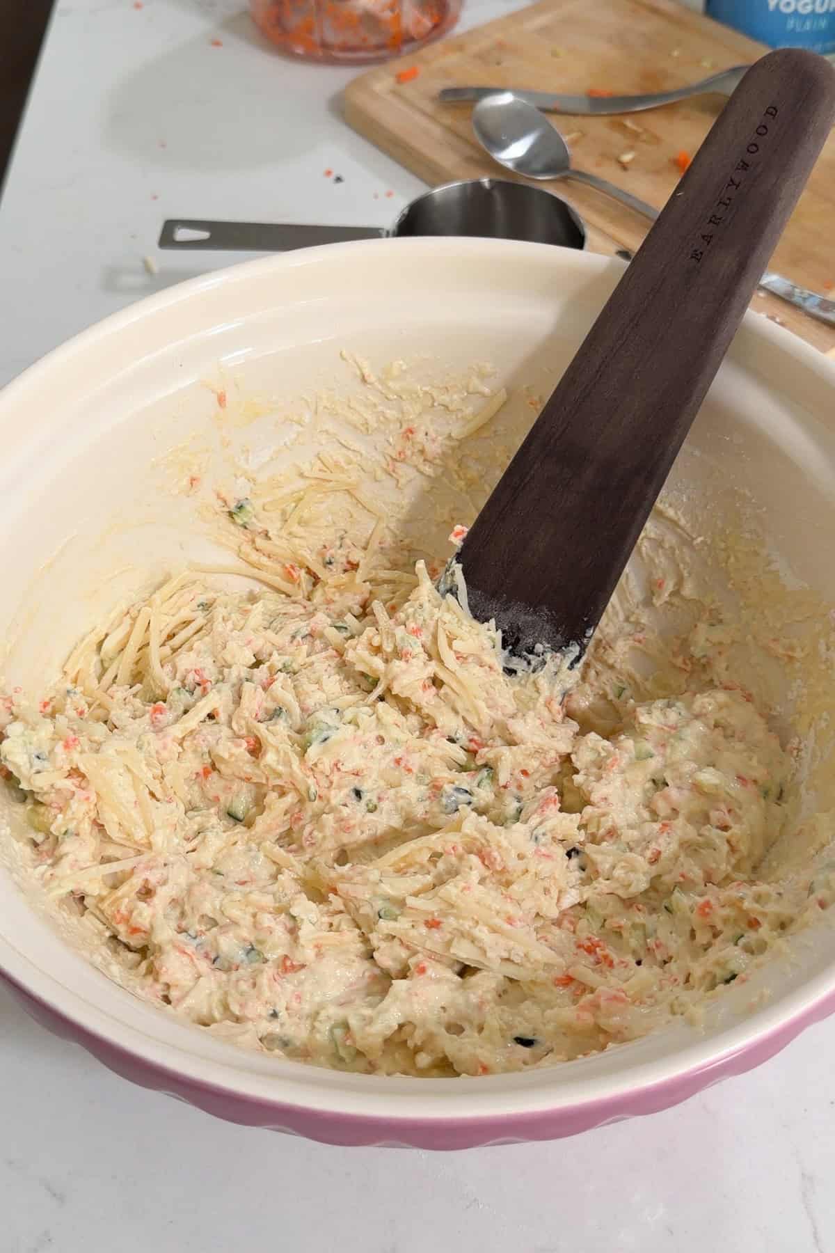 The cheese has been folded into the batter.