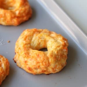 Baked bagel on a baking sheet.