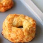 Baked bagel on a baking sheet.