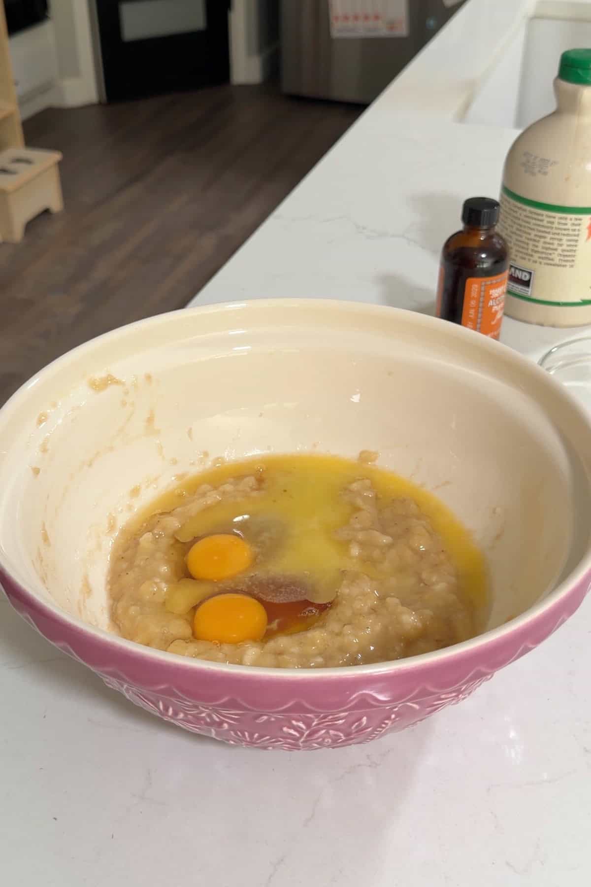 All the wet ingredients added to a large purple bowl.