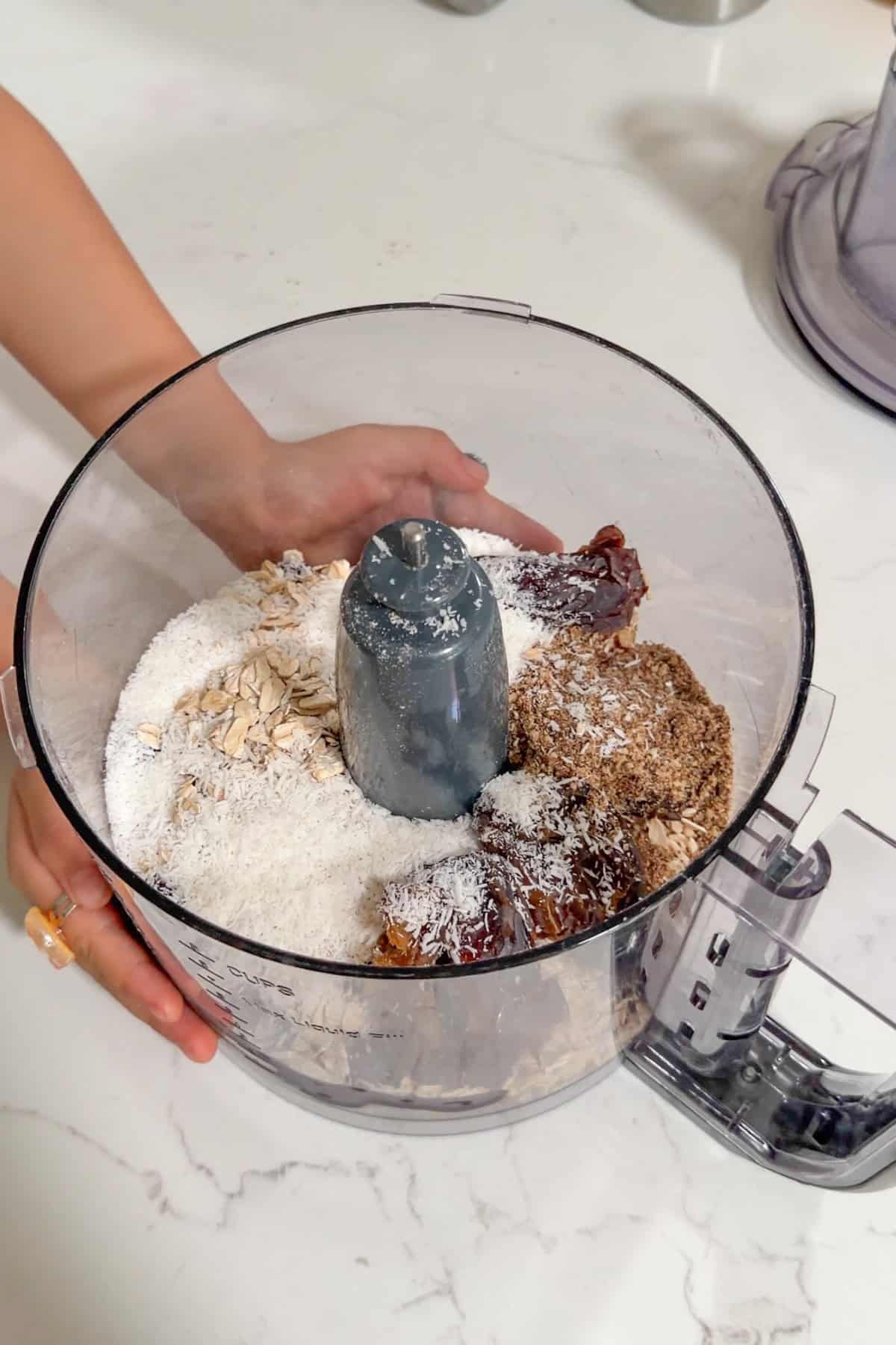 All the ingredients added to a food processor.