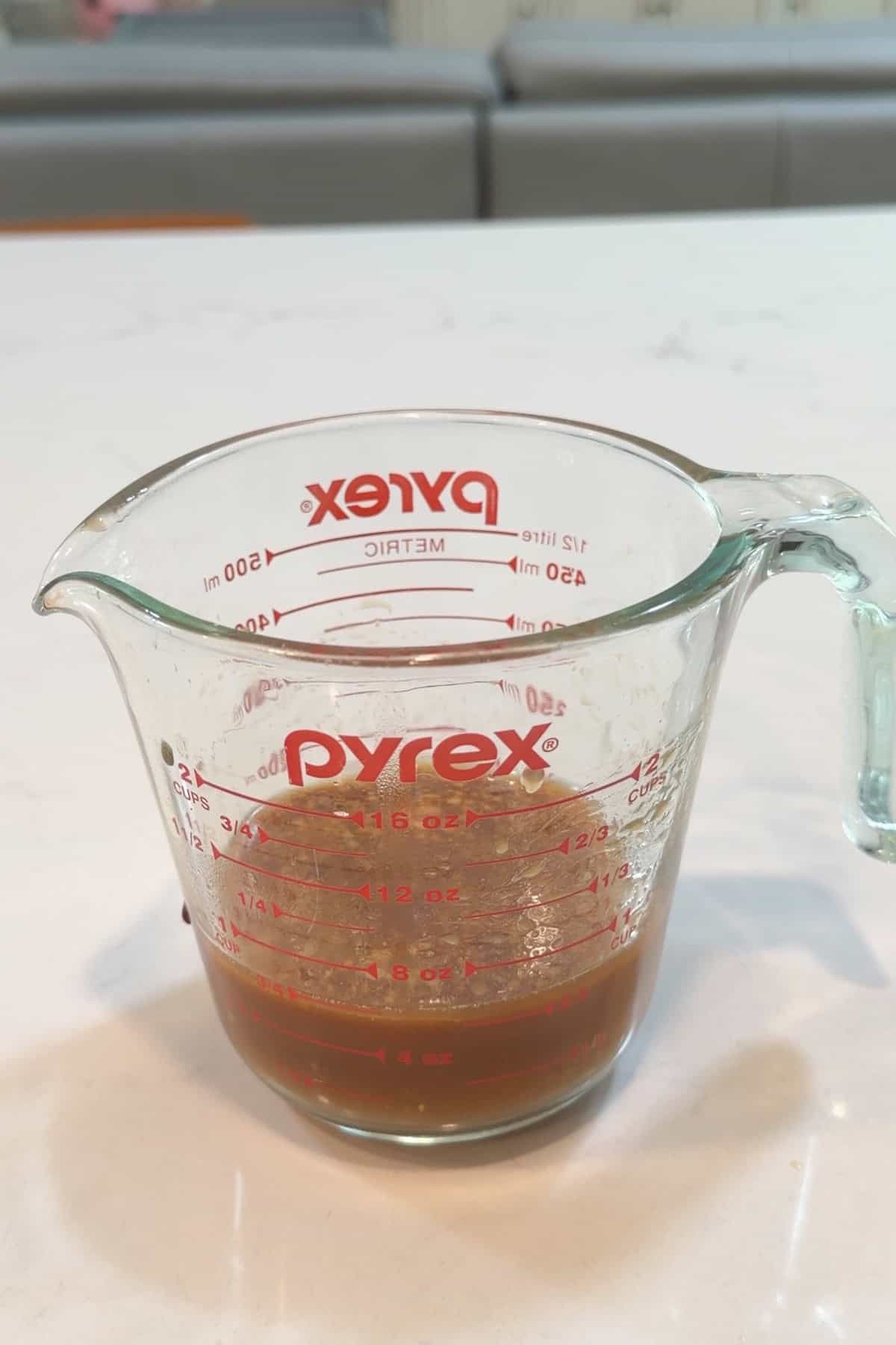 Stir fry sauce whisked together in a liquid measuring cup.
