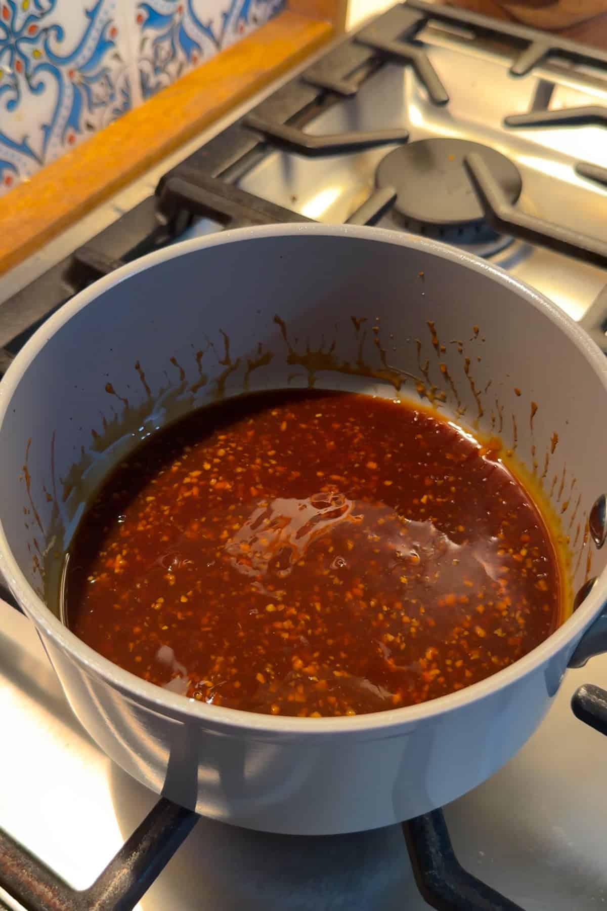 Homemade teriyaki sauce in a small saucepan.