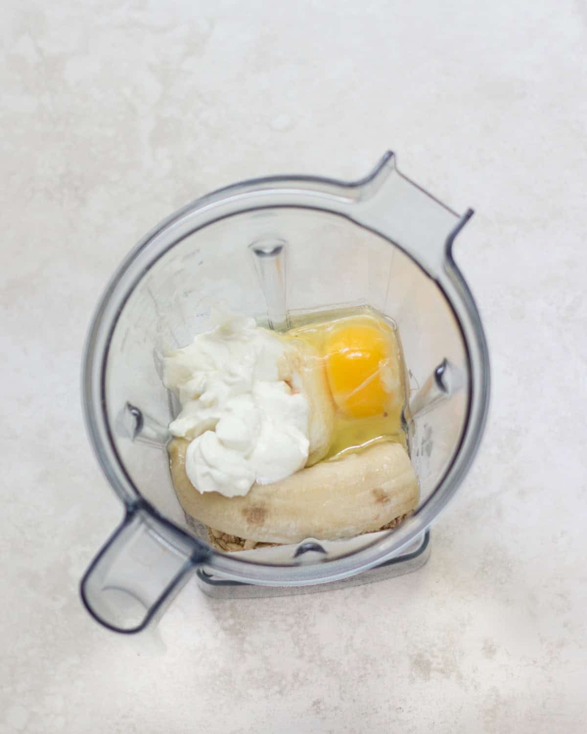 All the ingredients added to a blender.