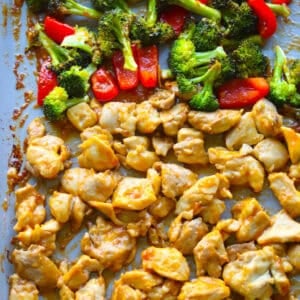 Cooked sheet pan orange chicken and vegetables.