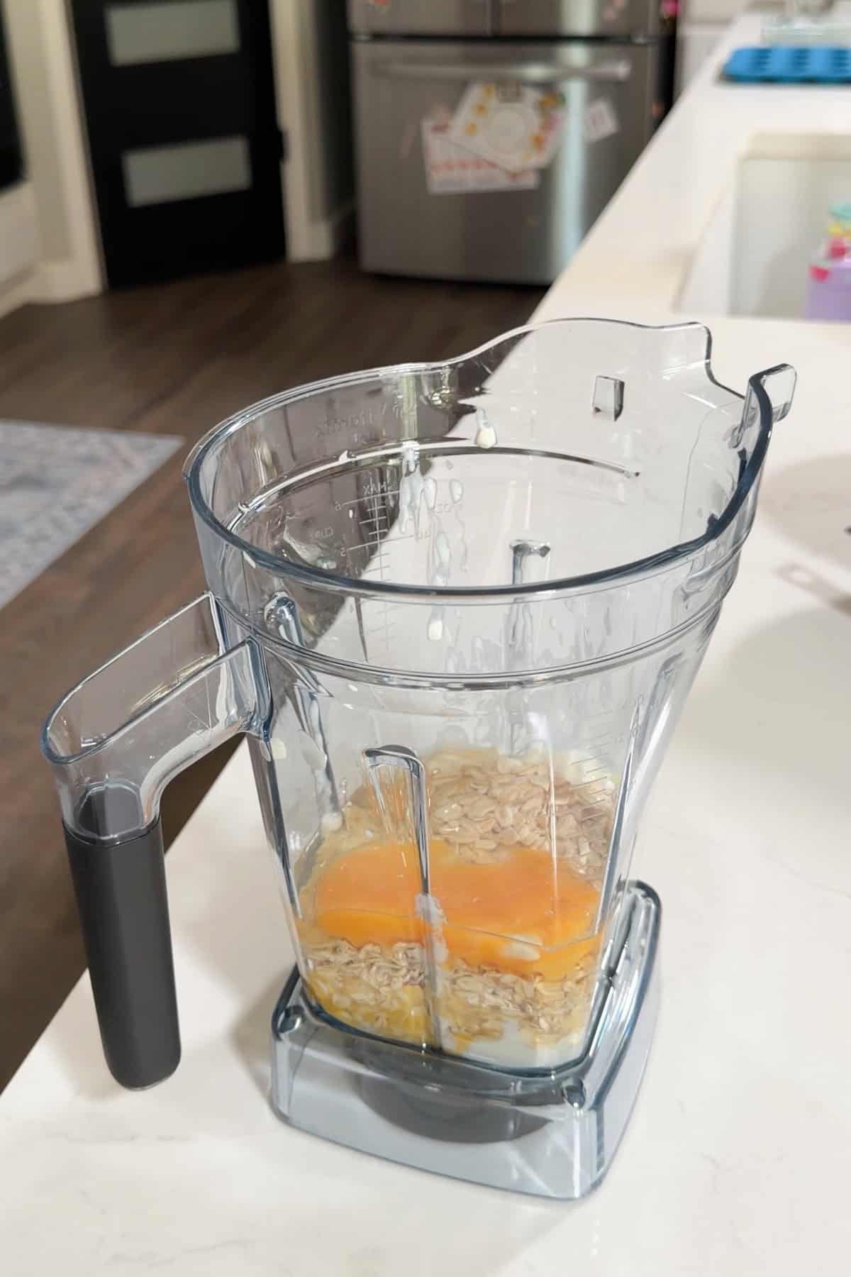 All the ingredients minus the blueberries added to a blender.