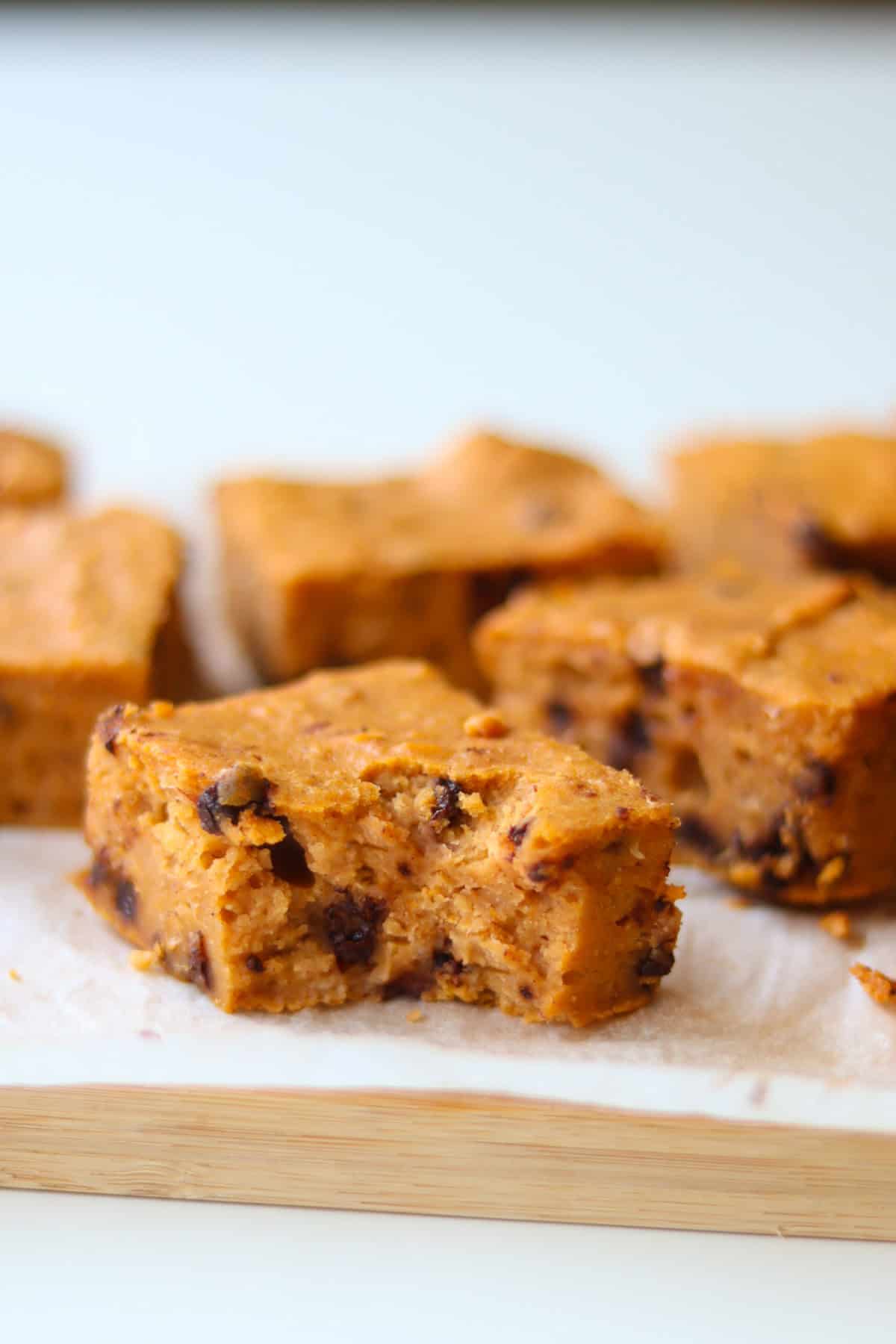 Sliced sweet potato bean blondies with a bite taken out.