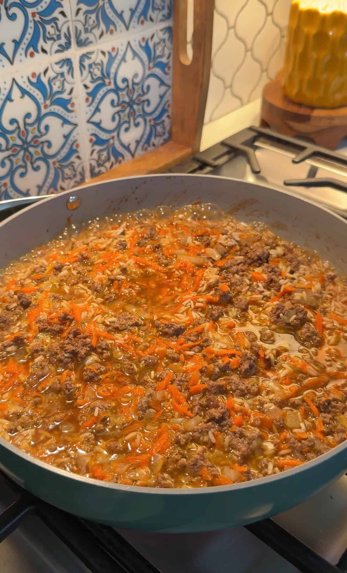 Carrots added to the ground beef mixture.