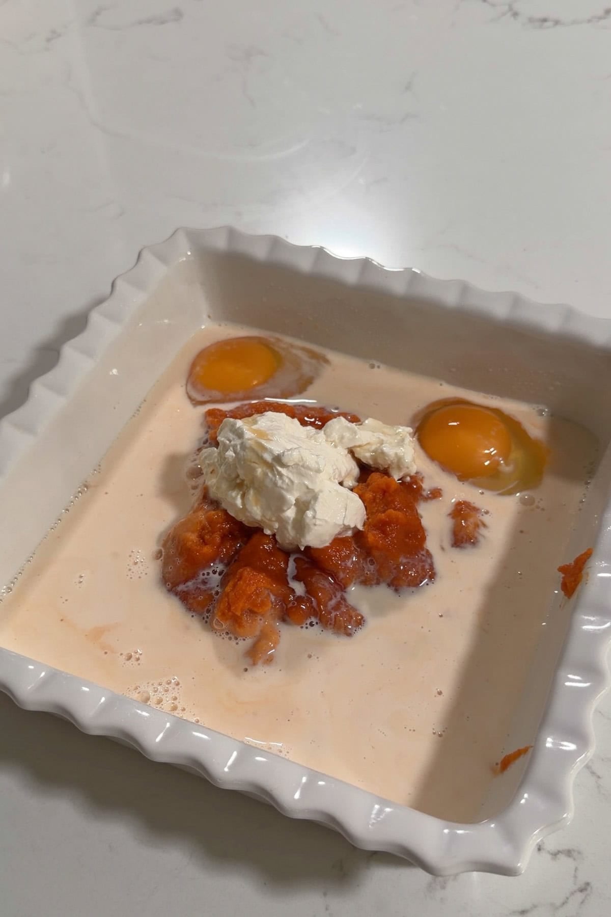 All the wet ingredients added to square baking dish.