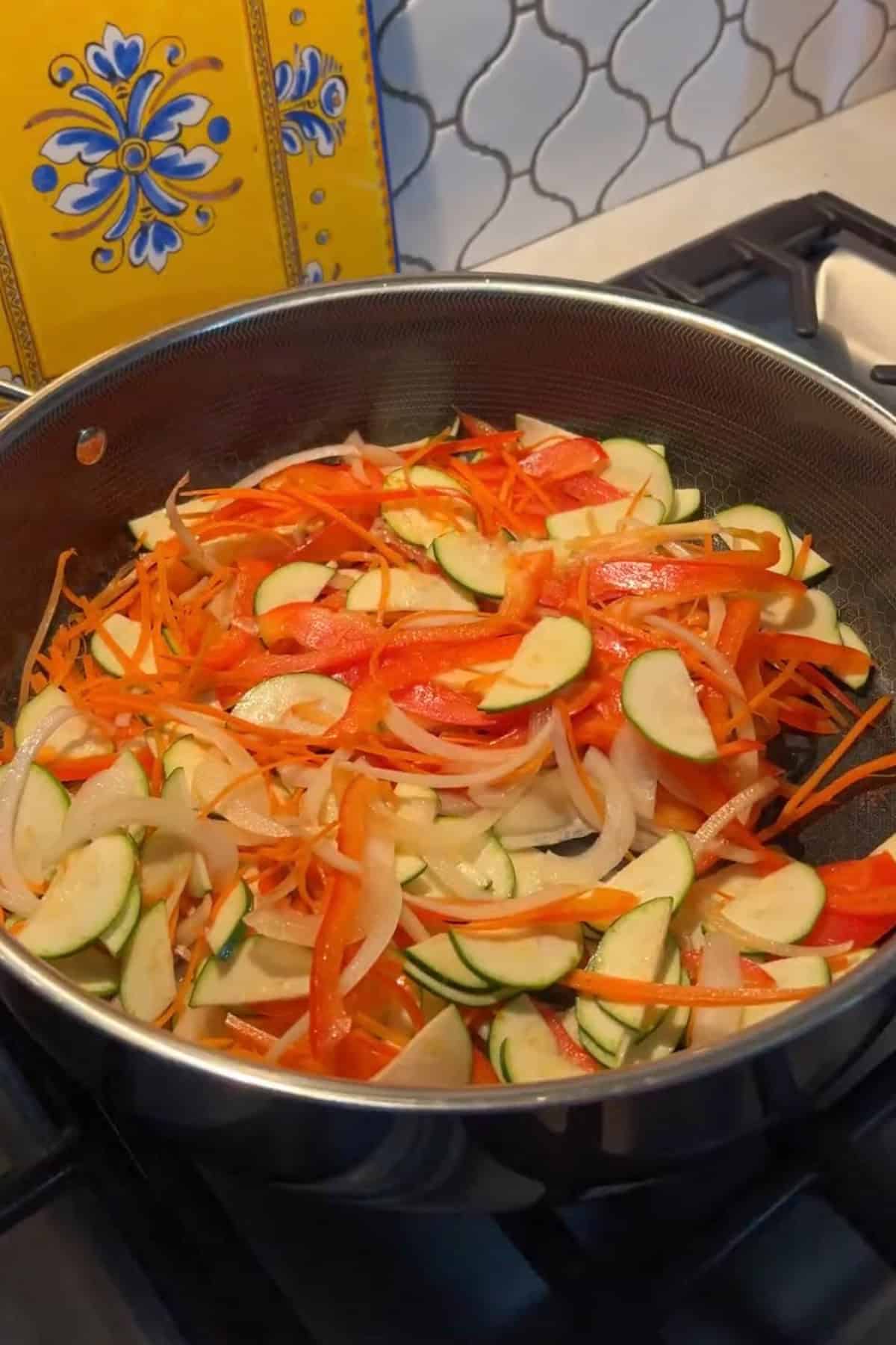 Vegetables added to the deep pan.
