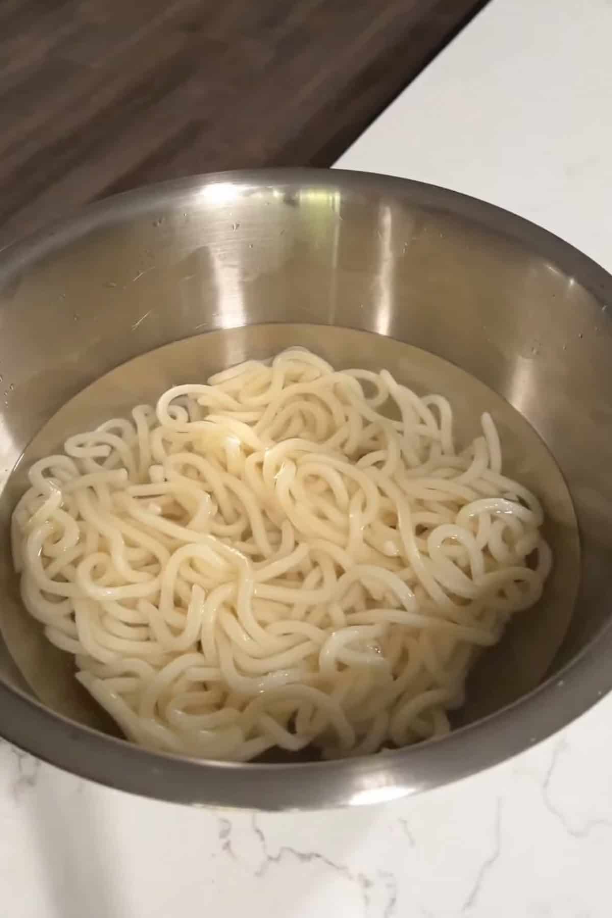 udon soaking in hot water.