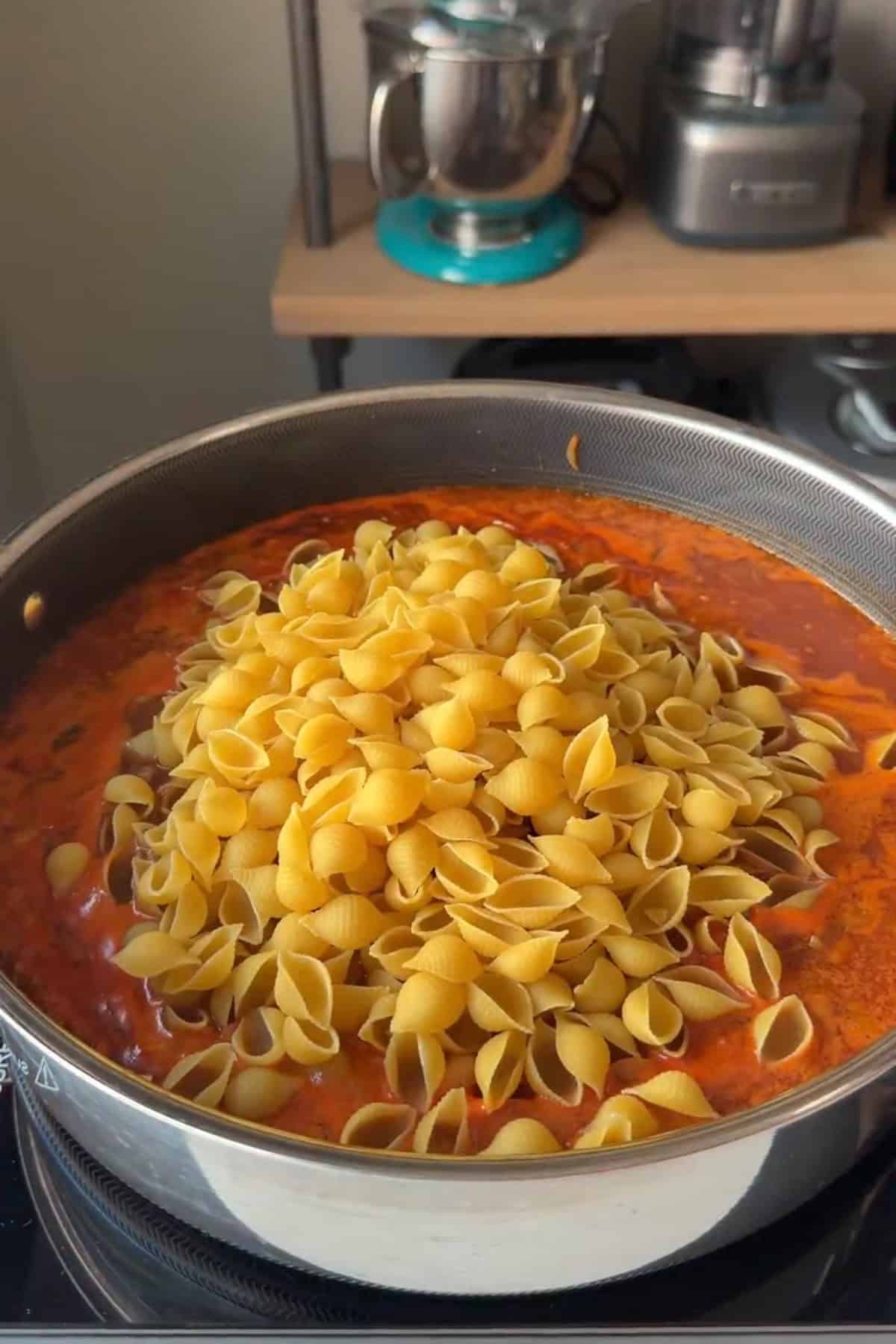 Liquid and pasta added to the deep pan.