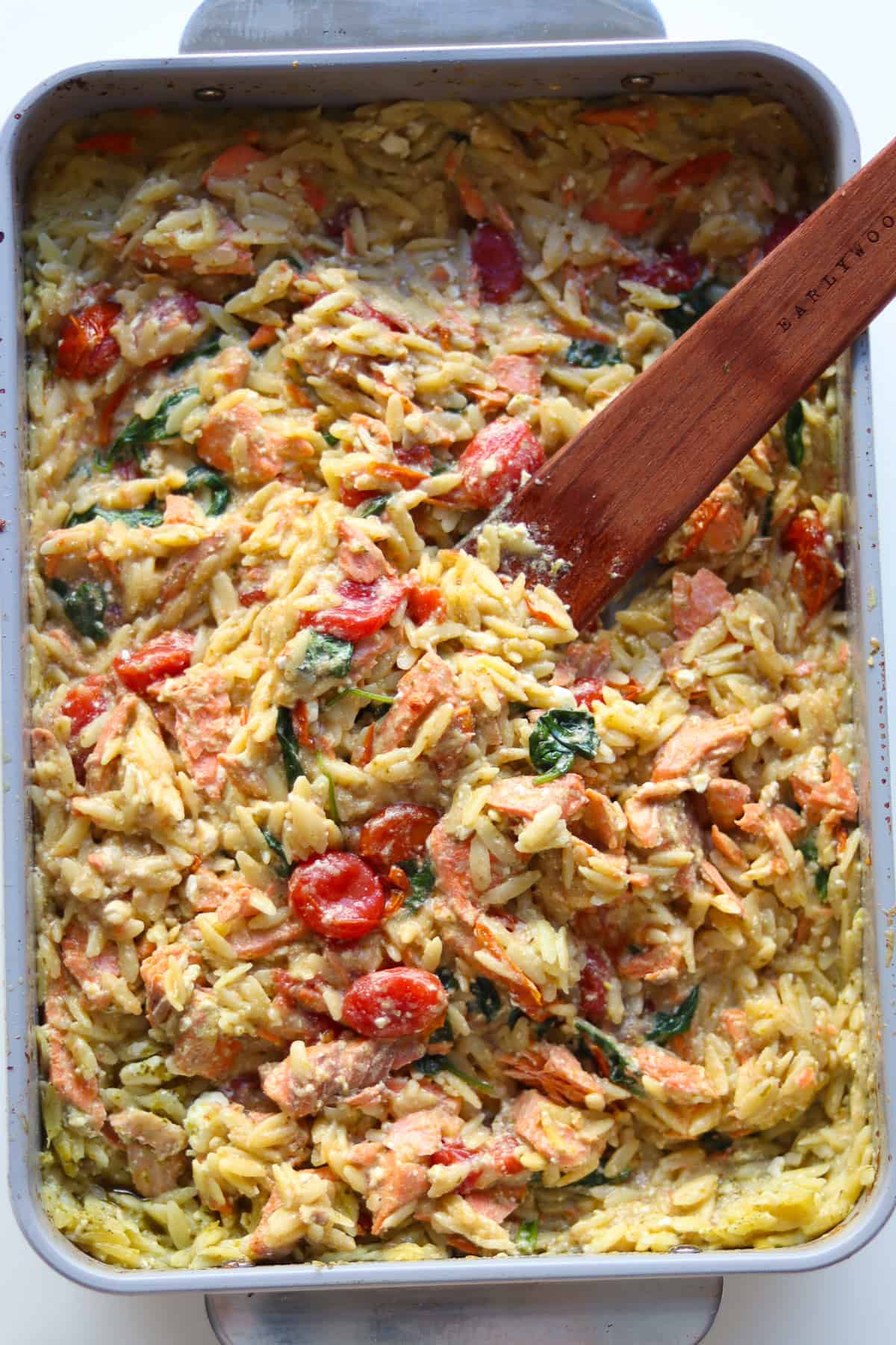 Cooked pesto salmon orzo bake.