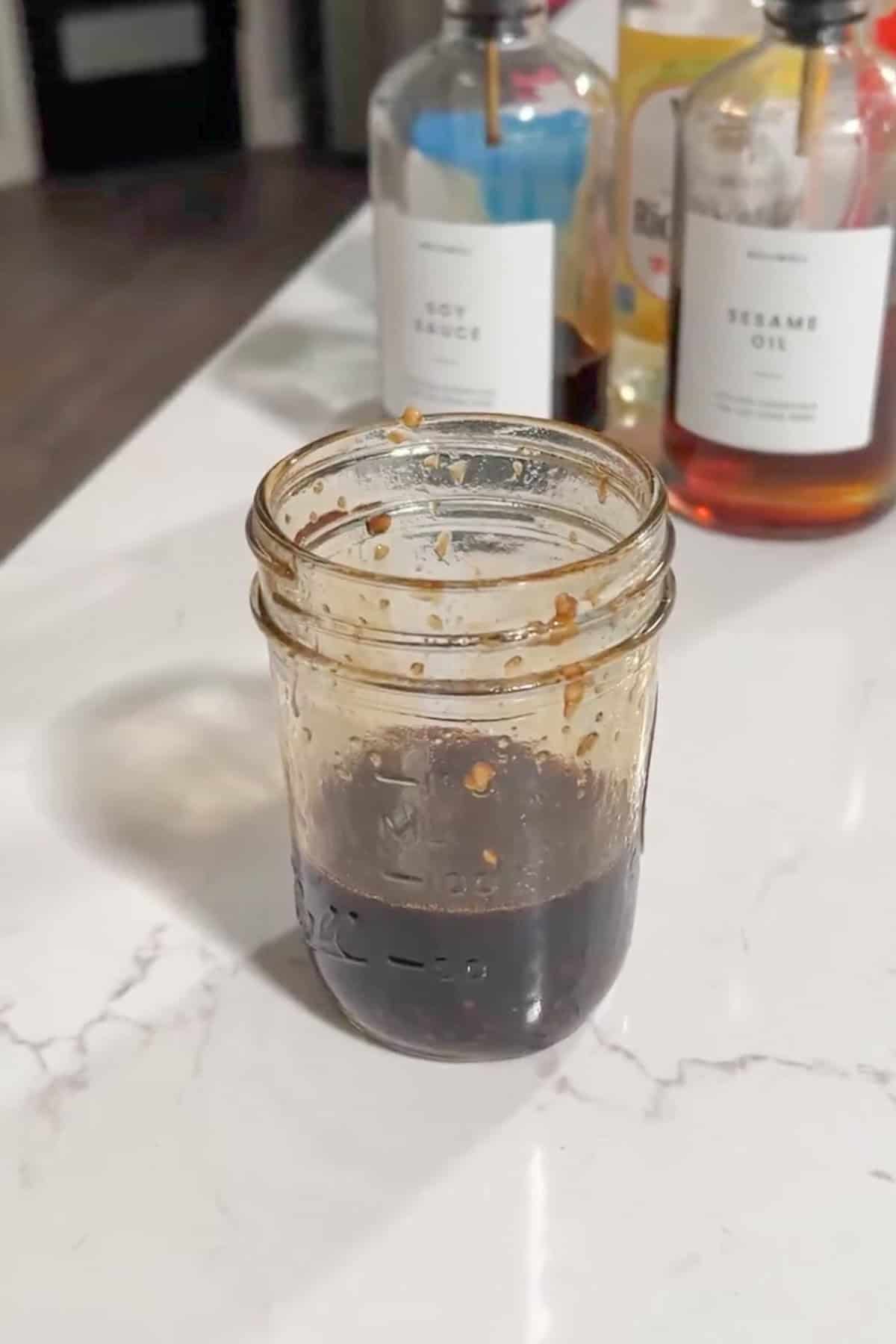 Sauce combined in a glass jar.