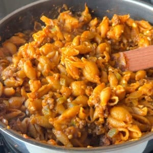 Creamy cottage cheese pasta with pumpkin in a large skillet.